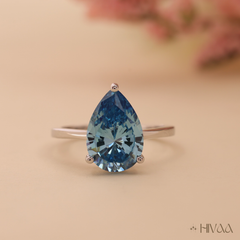 Pear Cut Blue Topaz Solitaire in White Gold