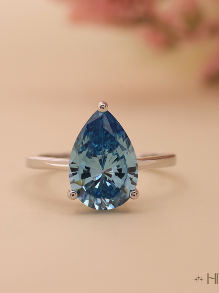 Pear Cut Blue Topaz Solitaire in White Gold