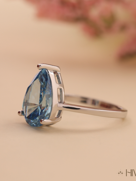 Pear Cut Blue Topaz Solitaire in White Gold